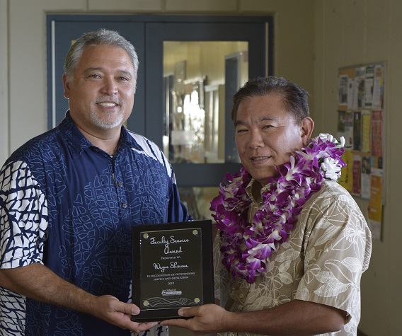 Professor Shiroma receiving award plaque from Dean Morioka